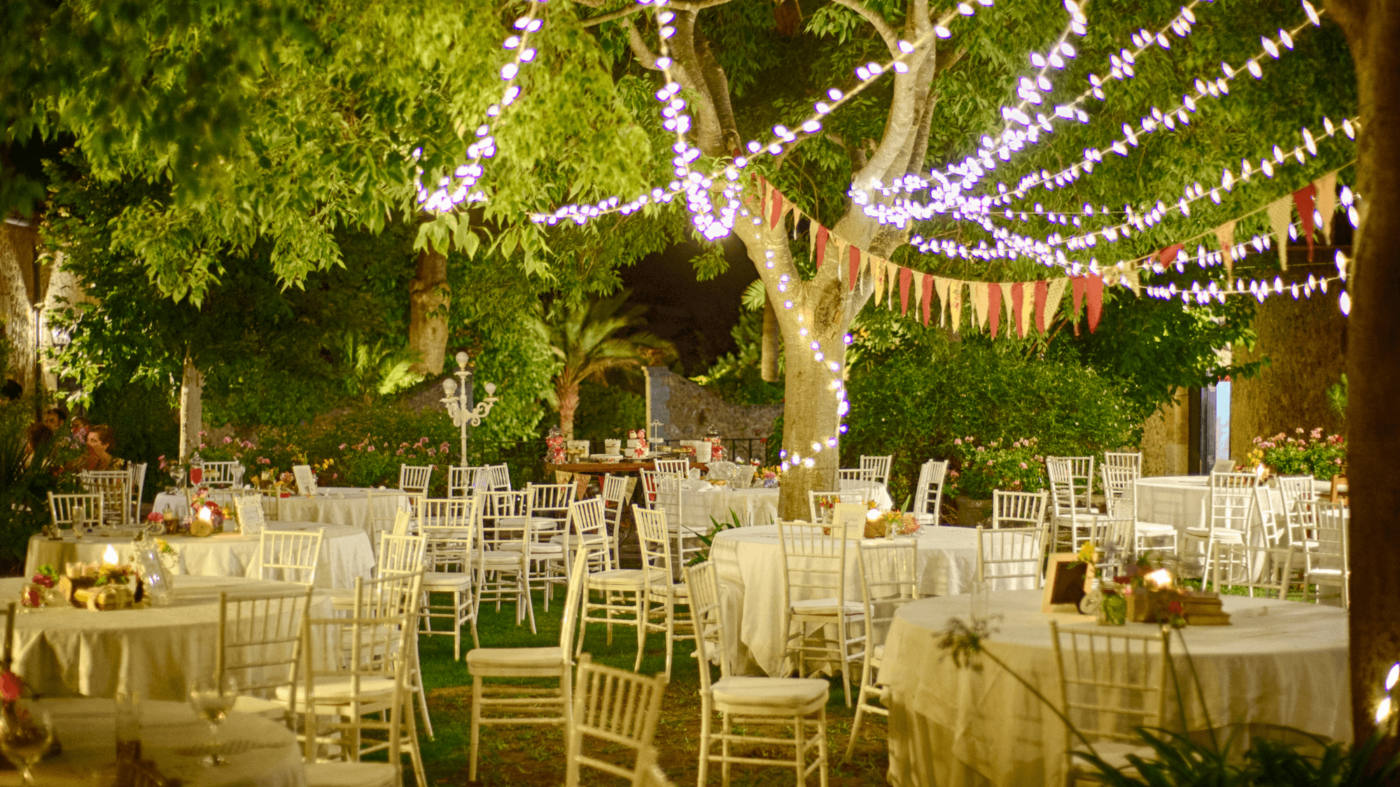 Outdoor wedding reception with string lights